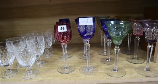 A group of coloured hock glasses and cut glass goblets